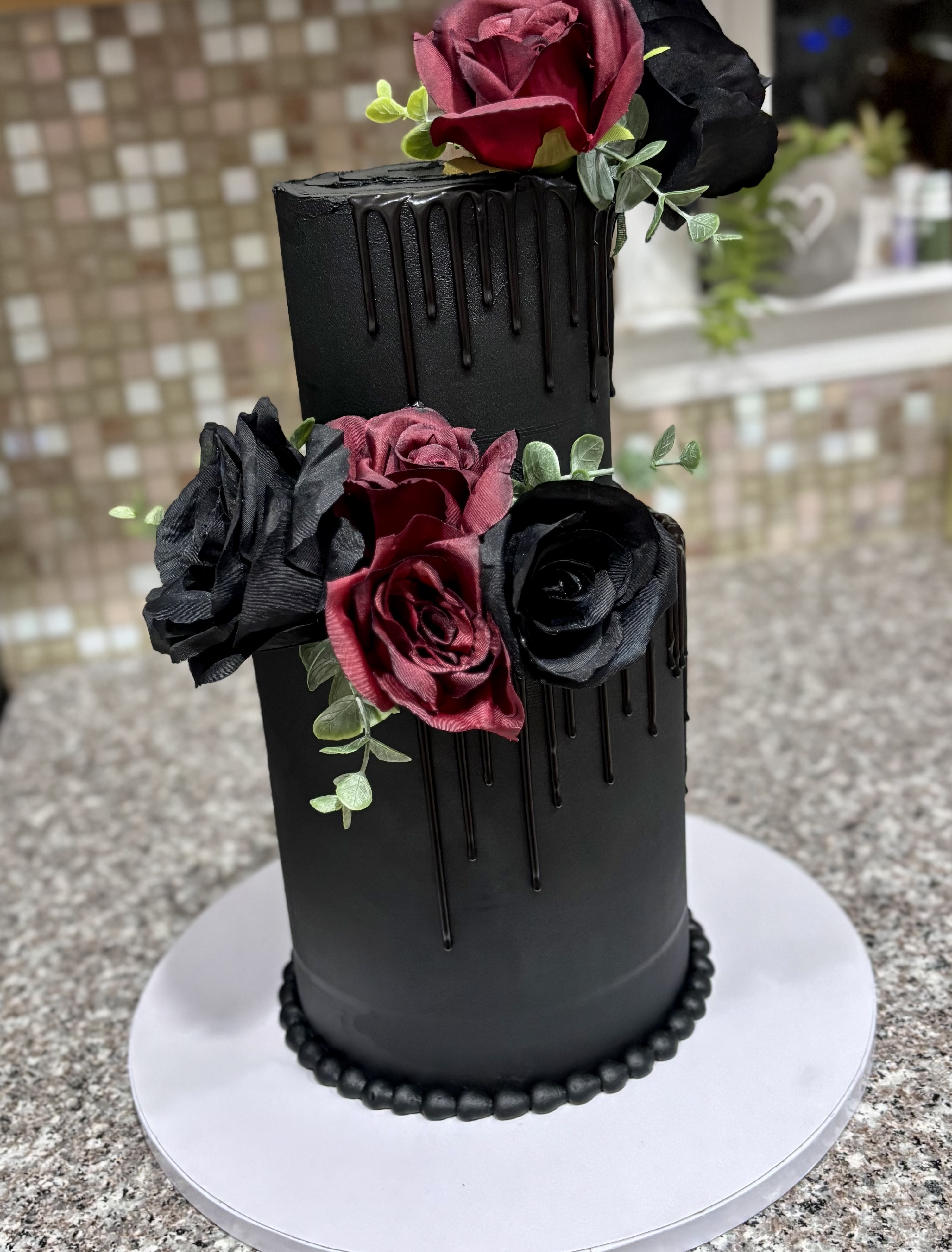 Black floral tiered cake